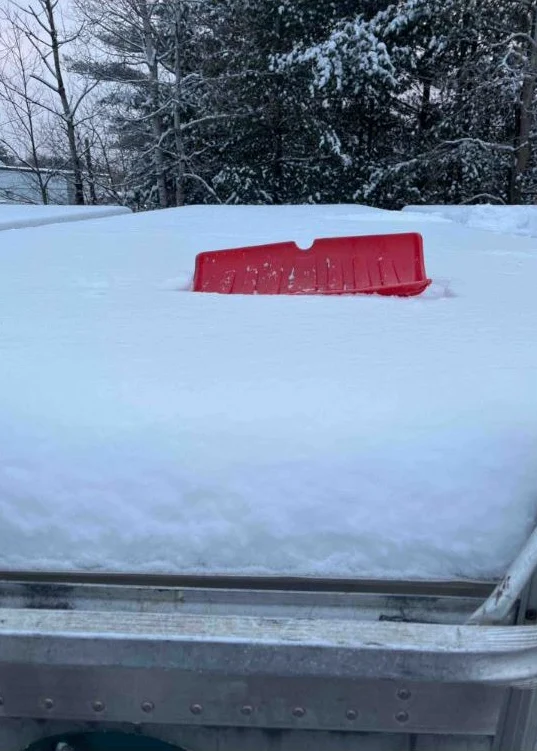 Before: Trailer covered in heavy snow